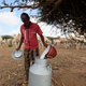 Pouring camel milk in Mogadishu, Somalia.
